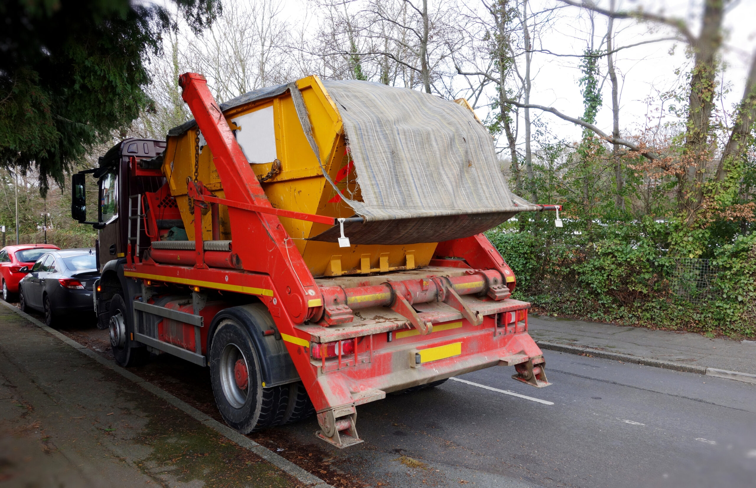 Mini skip on the back of a Newport Skip Hire transporter vehicle